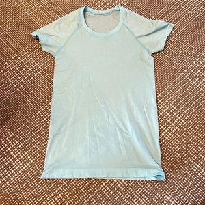 Lululemon teal shirt size 4.